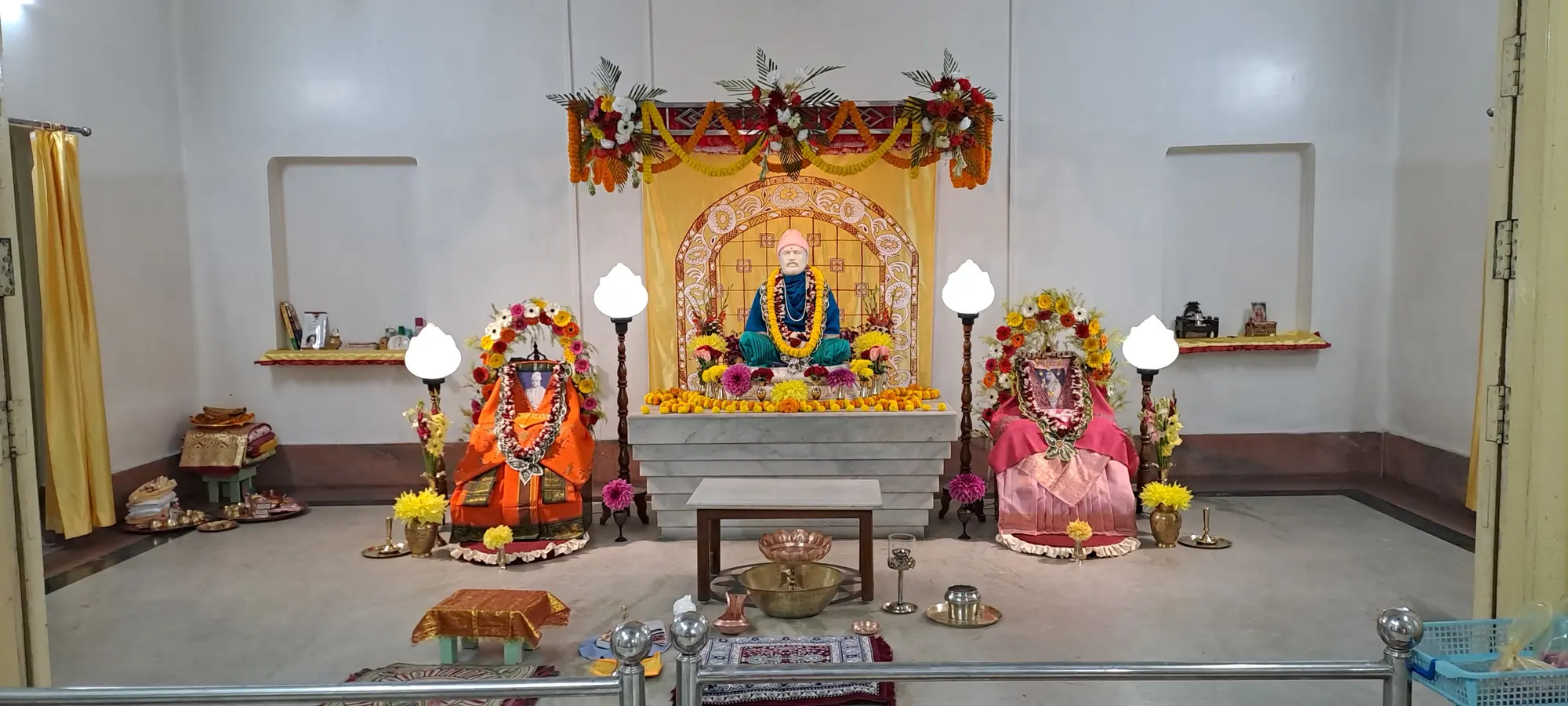 The shrine of Ramakrishna Math, Coochbehar, with images of the Holy Trio